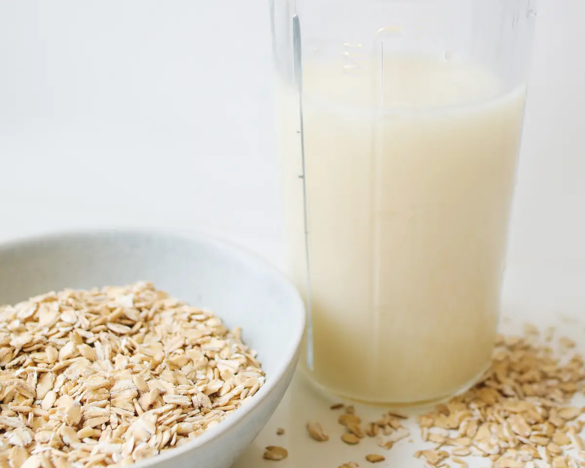 Oat milk with a boal of oats 