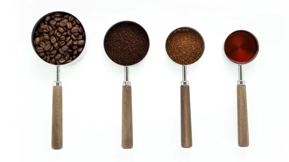 Measuring cups with coffee 